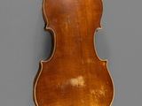 an old violin with a wooden back and a long neck