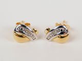 a pair of gold and diamond earrings on a white background
