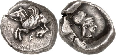 a close up of a coin with a horse and a man on it