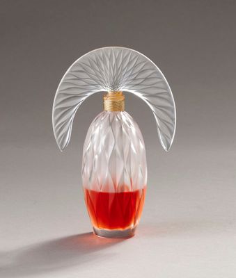 an image of a glass bottle with a red liquid in it