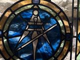 a stained glass window with a picture of a man holding a sword