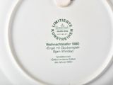a white plate with a green and white design on it