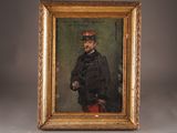 portrait of a man in a military uniform in a gold frame