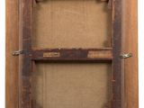 an old picture frame with a wooden frame attached to it