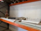 a shelf that has a lot of metal items on it