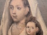 painting of a woman holding a child in her arms