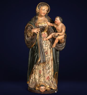 a statue of a woman holding a baby in her arms