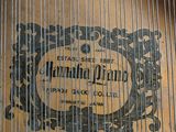 a close up of a piano with a label on it