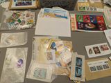 many different types of stamps laid out on a table