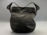 an image of a black purse sitting on top of a table
