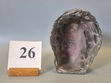 a small shell with a number on it next to a sign