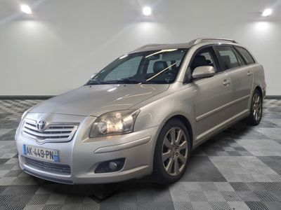 a picture of a silver car parked in a garage