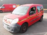 a red van that is parked in a parking lot