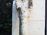 a stone column on the side of a building