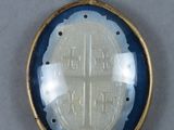 a picture of a gold and blue locke with a cross on it
