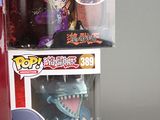 a box with a toy and a box with a figure in it