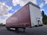 a semi trailer that is parked in a parking lot