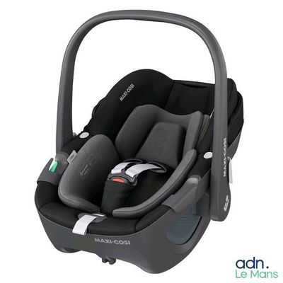 a close up of a car seat with a baby in it