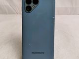 a close up of the back of a blue iphone 11