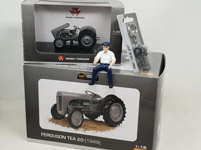 a toy man sitting on top of a tractor in a box