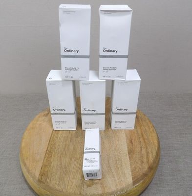 a stack of boxes on a wooden stand on a table