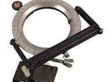 an image of a circular dial on a tripod