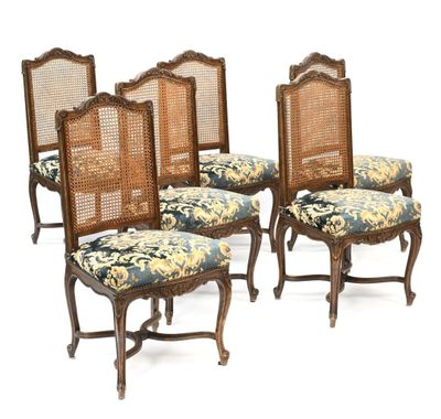 un ensemble de quatre chaises de salle à manger de style Louis II à dossier en rotin