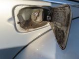 an image of a gas pump in a white car
