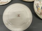 four plates that are sitting on a table