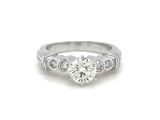 a white gold engagement ring with a round brilliant cut diamond