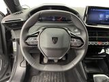 the interior of a car with a steering wheel and dashboard controls