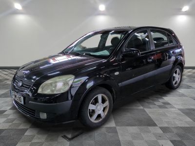 a picture of a black car parked in a garage