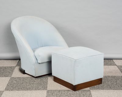 an image of a blue chair and ottoman on a checkered floor