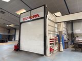 a garage with a large open door in the middle of it
