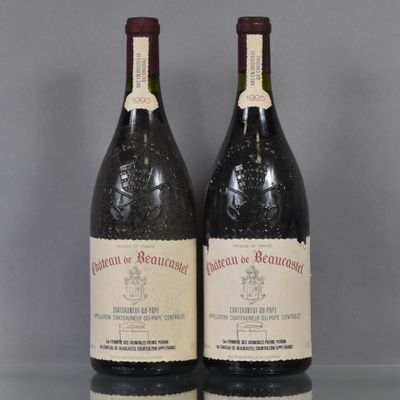 two bottles of wine sit on a table with a gray background