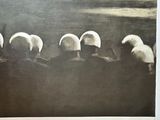a black and white photo of a group of sheep wearing helmets