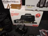 a box with a camera and other items on the floor