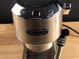 a coffee maker that is sitting on a wooden table
