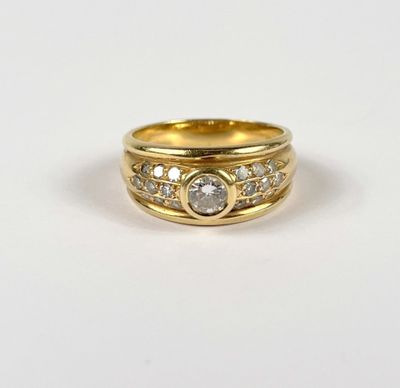a close up of a gold ring with diamonds on it