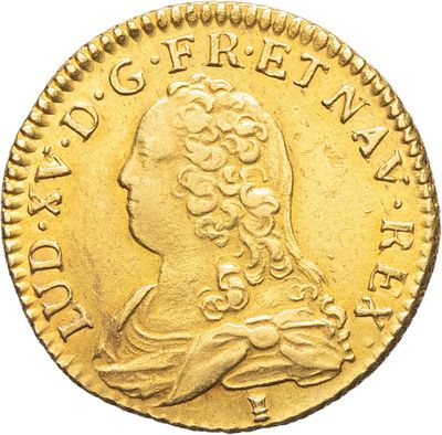 l'image d'une pièce d'or sur laquelle figure une tête de femme
