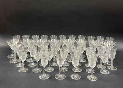 a lot of wine glasses that are sitting on a table