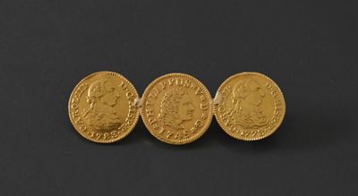 three gold sovereigns on a black background