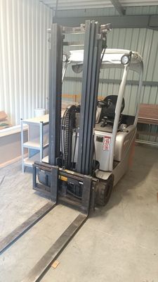 a fork lift truck parked in a warehouse