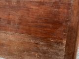 a small wooden table with a drawer on top of it