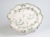 a white plate with a green and white design on it