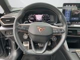 the interior of a car with a steering wheel and dashboard controls