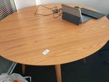 a small table with a laptop on top of it