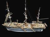 a model of a ship on display on a black background