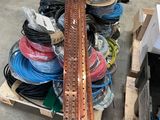 many different types of wires on a pallet in a warehouse