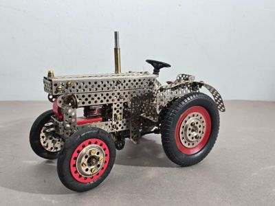 a toy tractor that is sitting on a table